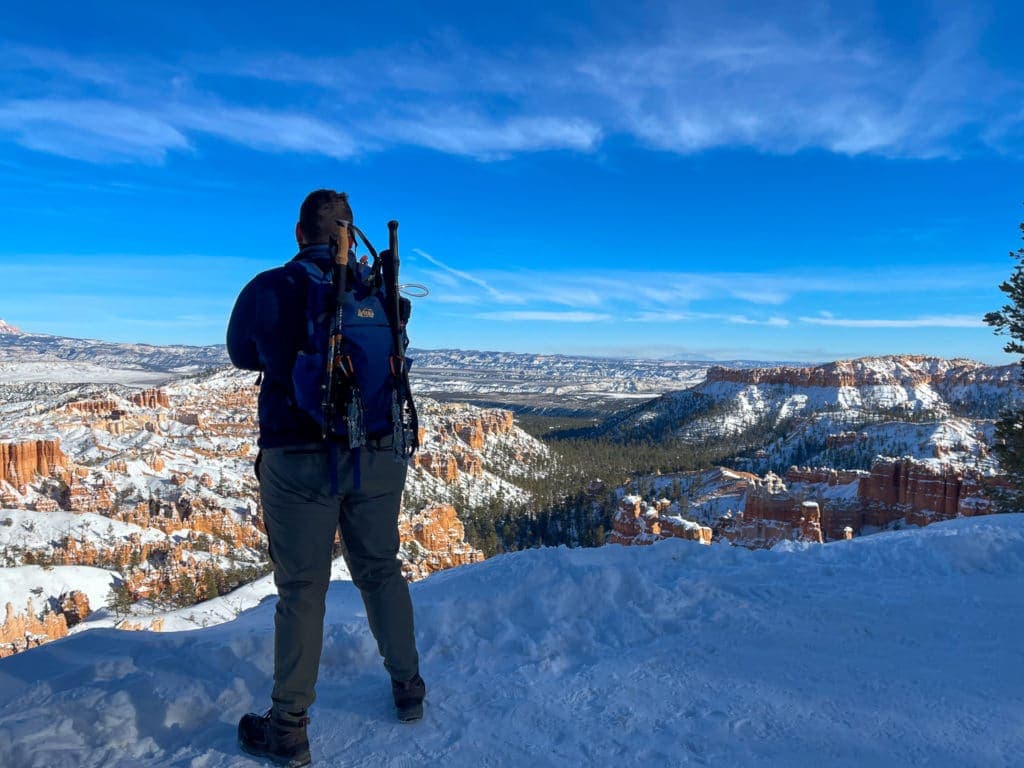 Gus with camera on mountain peak